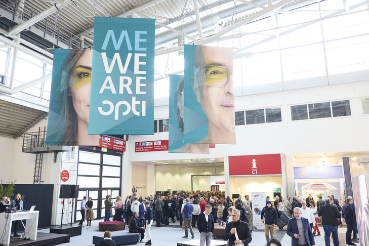 Visitors stream through the entrance of Messe München to discover the latest innovations and trends in the optics industry at opti 2024. Source: opti